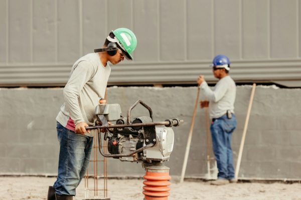 a coupe of men working at a construction site