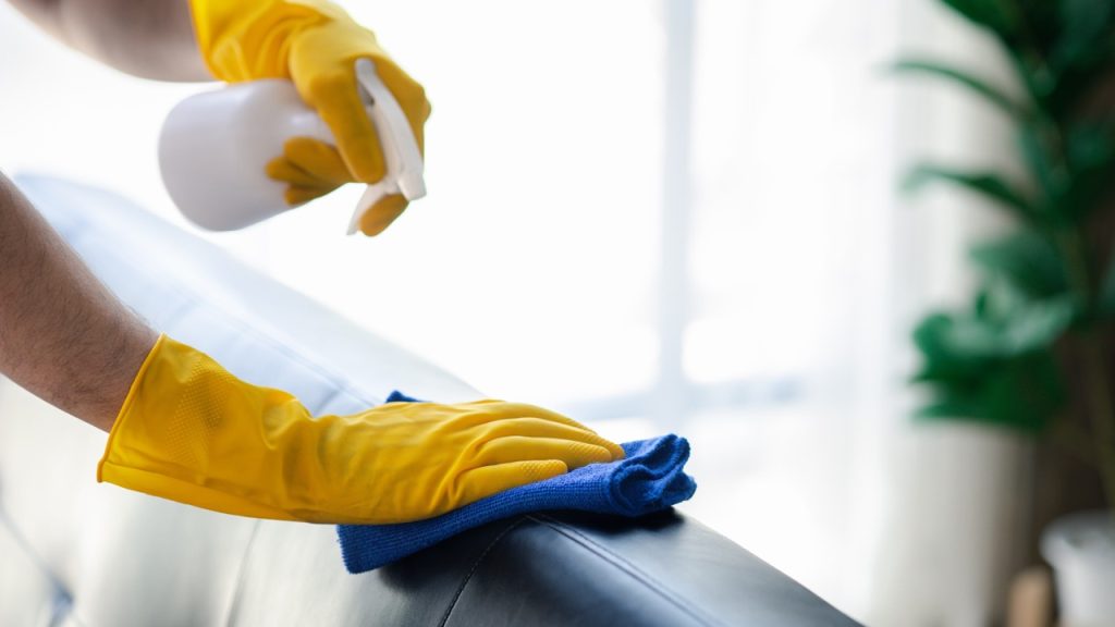 commercial cleaning staff disinfecting a surface