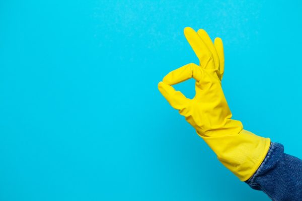 hand in yellow cleaning glove